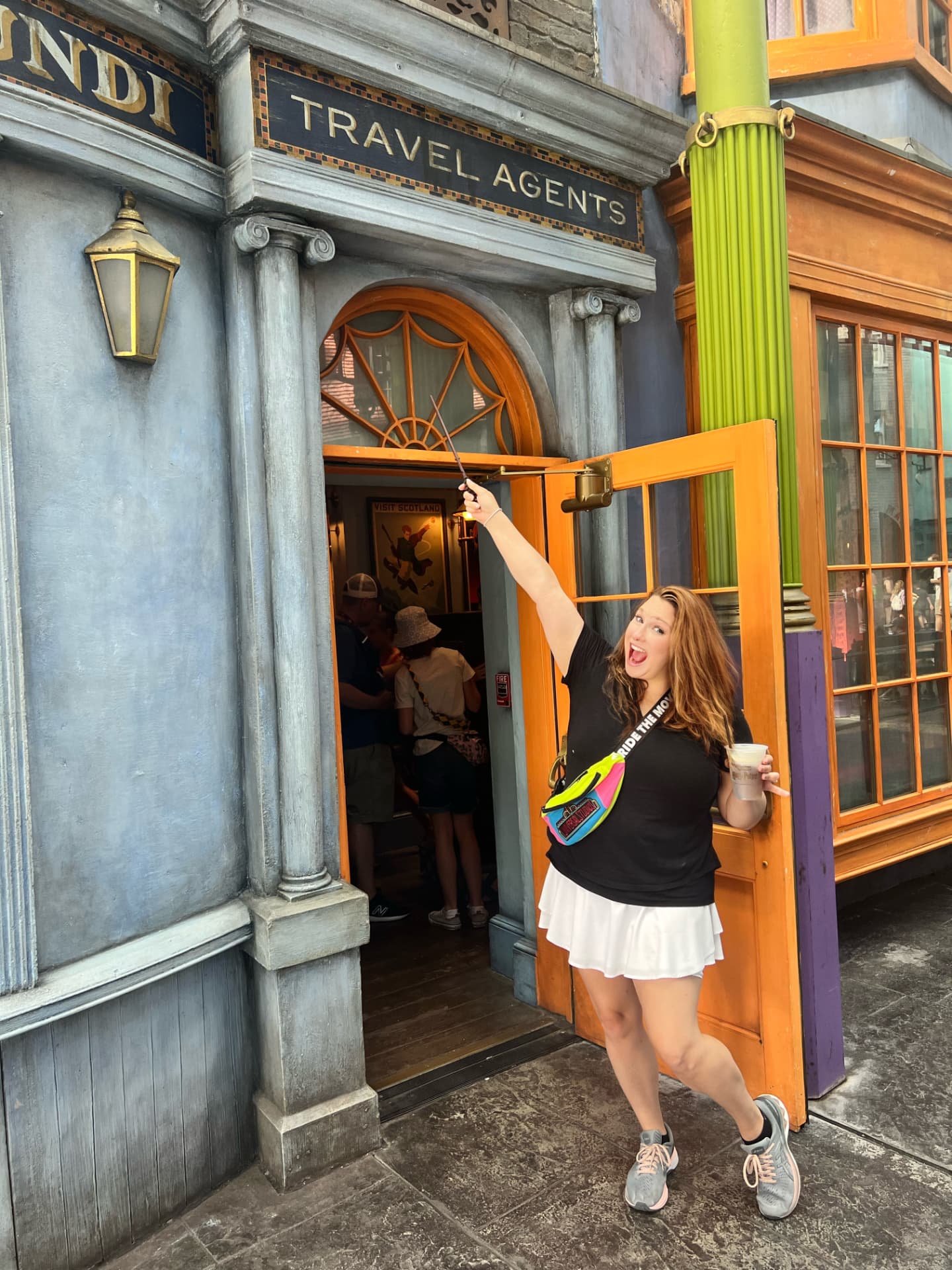 Jamie Thomas outside the travel agents storefront at Universal Studios