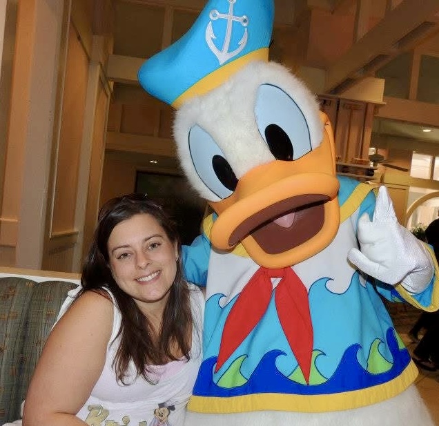 Steph with Donald Duck at a Disney resort