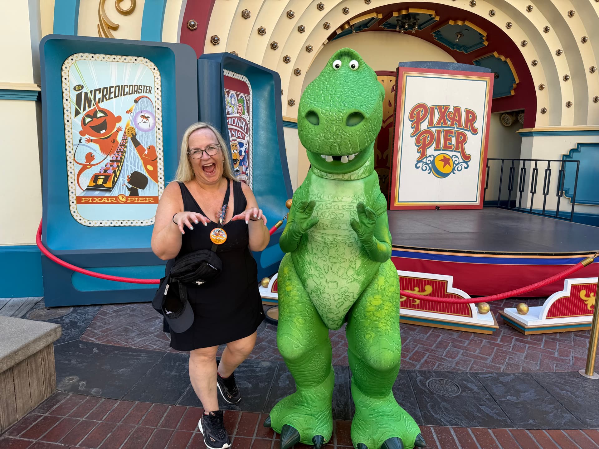 Teresa Mazzotta with Rex at Pixar Pier