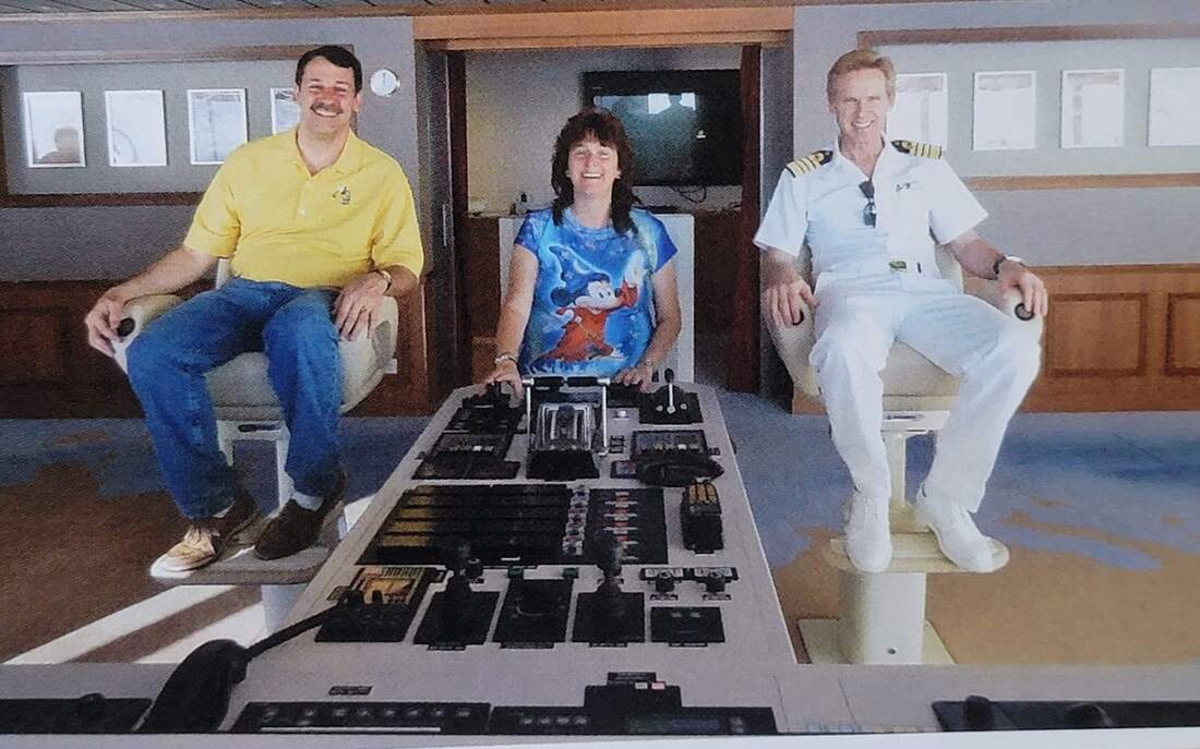 Faith Colletti on the bridge of the Disney Dream with Captain Tom during the maiden voyage