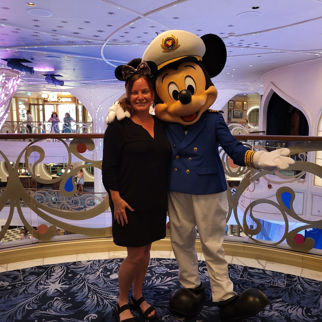 Heather with Captain Mickey on a Disney Cruise Line ship