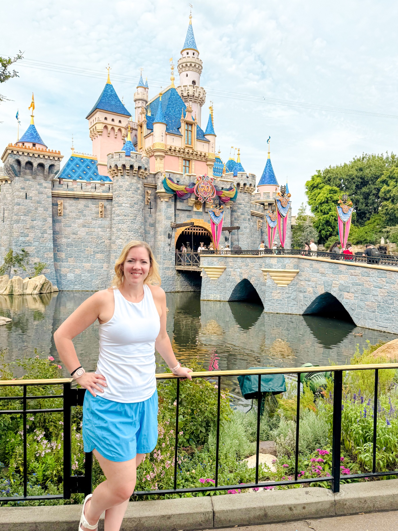 Cheryl Di Natale in front of Sleeping Beauty Castle during Disneyland's 70th anniversary