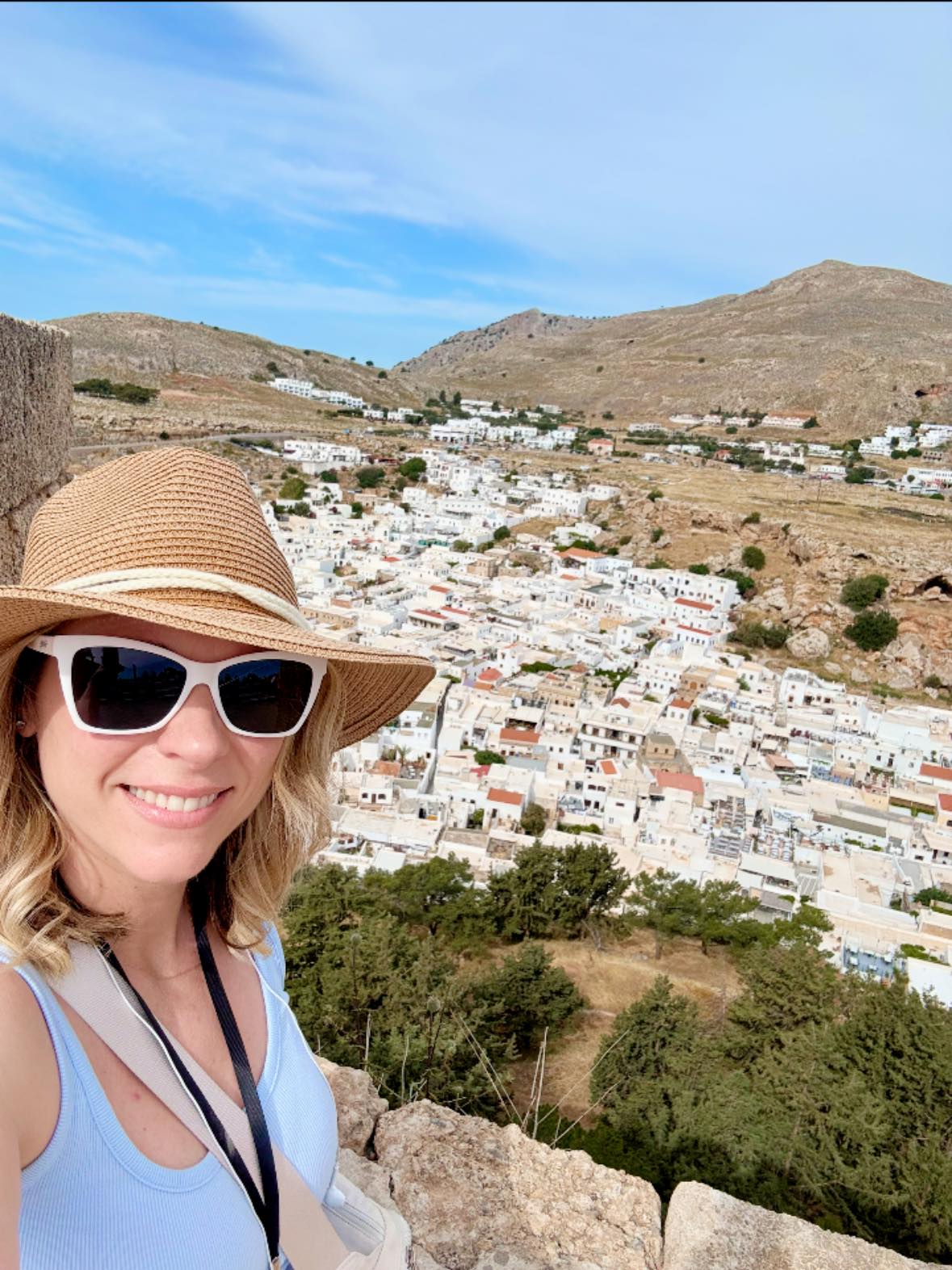 Michelle overlooking the village of Lindos from the Acropolis in Rhodes, Greece on her Adventures by Disney trip
