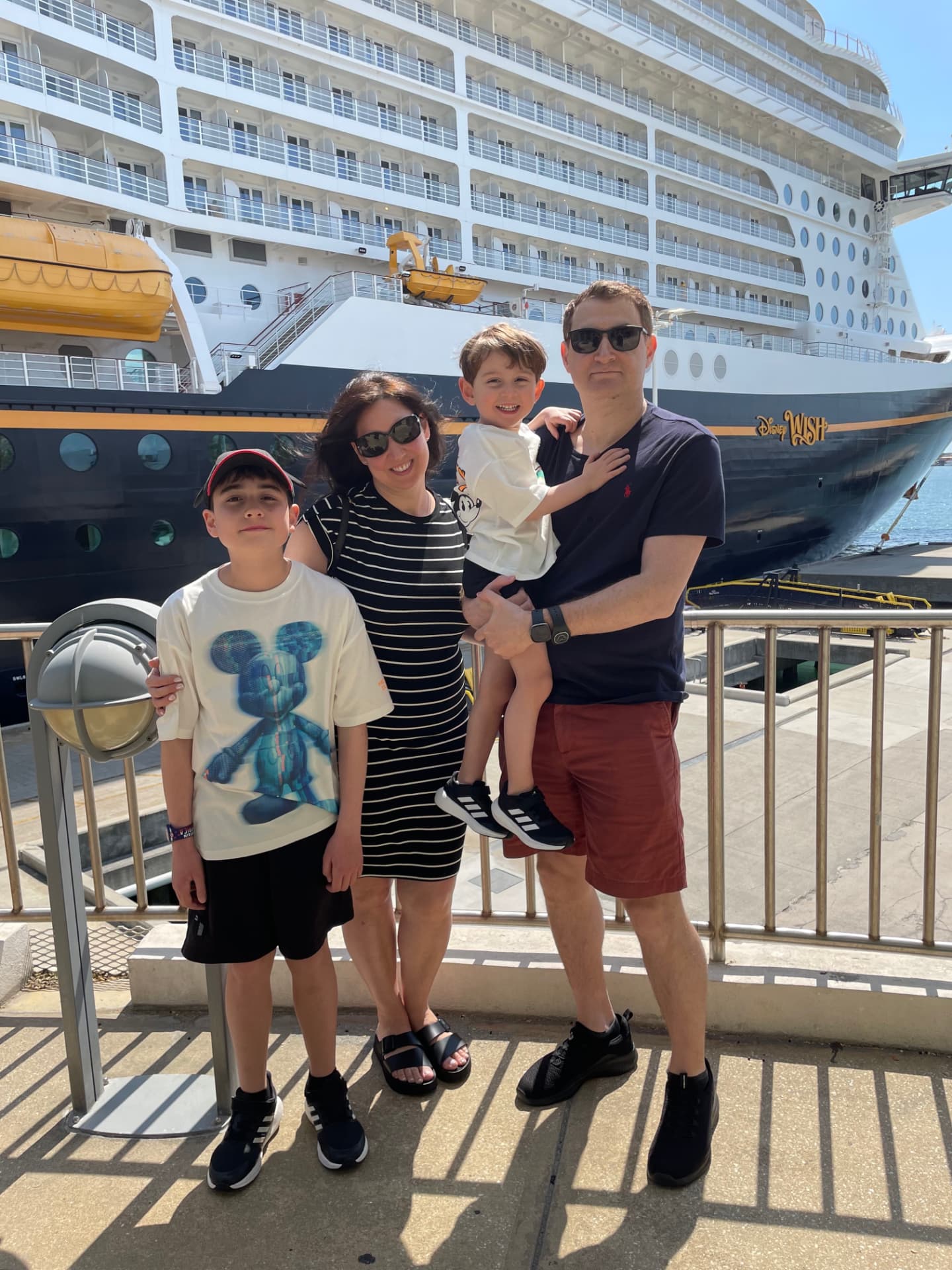 Diana Tombolillo and her family beside the Disney Wish