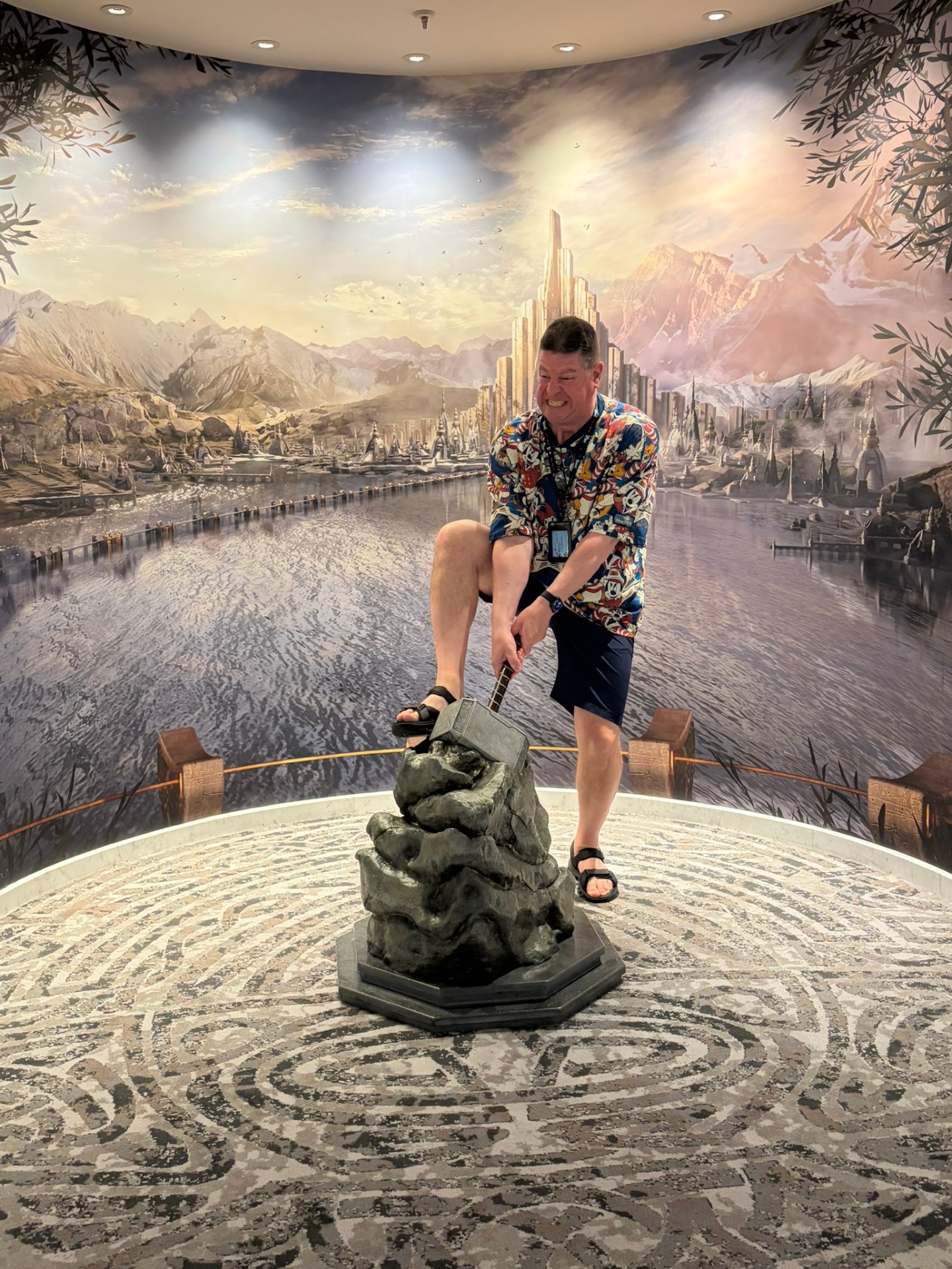 Steve Maude trying to lift Thor's hammer Mjolnir on the Disney Adventure