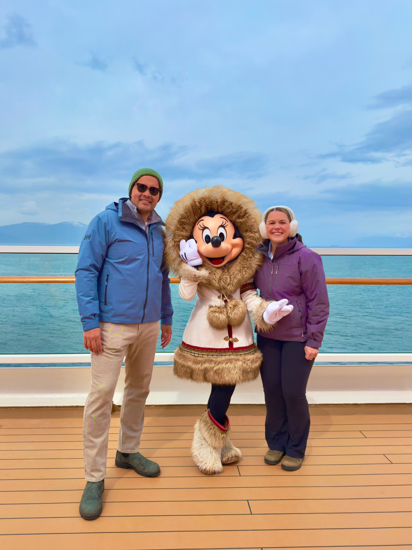 Manuel Suarez Delgado and his wife with Minnie Mouse aboard a Disney Alaska cruise