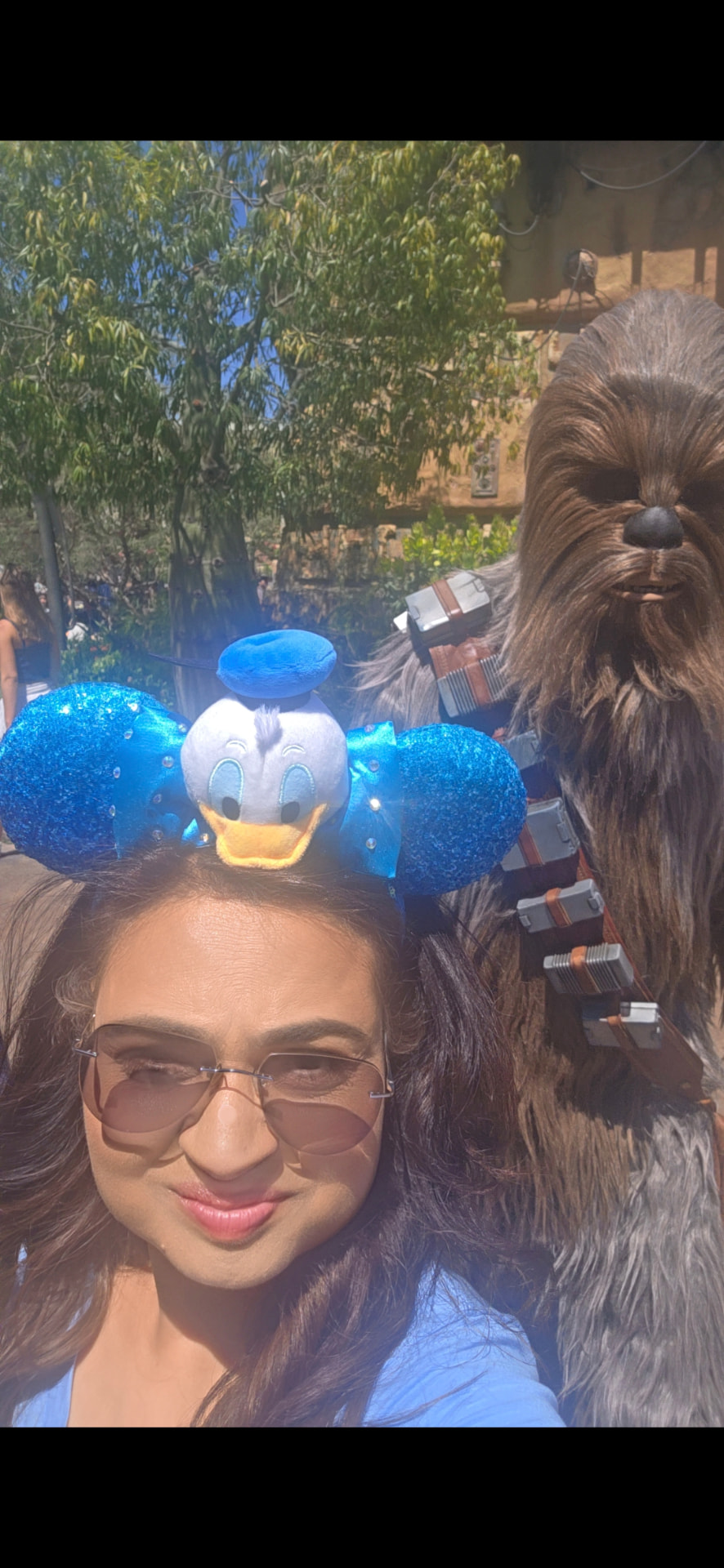 Farya Zubair with Chewbacca at Star Wars Galaxy's Edge in Disneyland