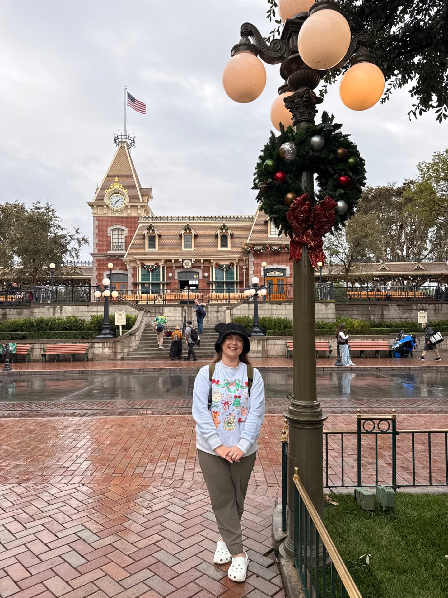 Jenna Caron in front of the Disneyland train station